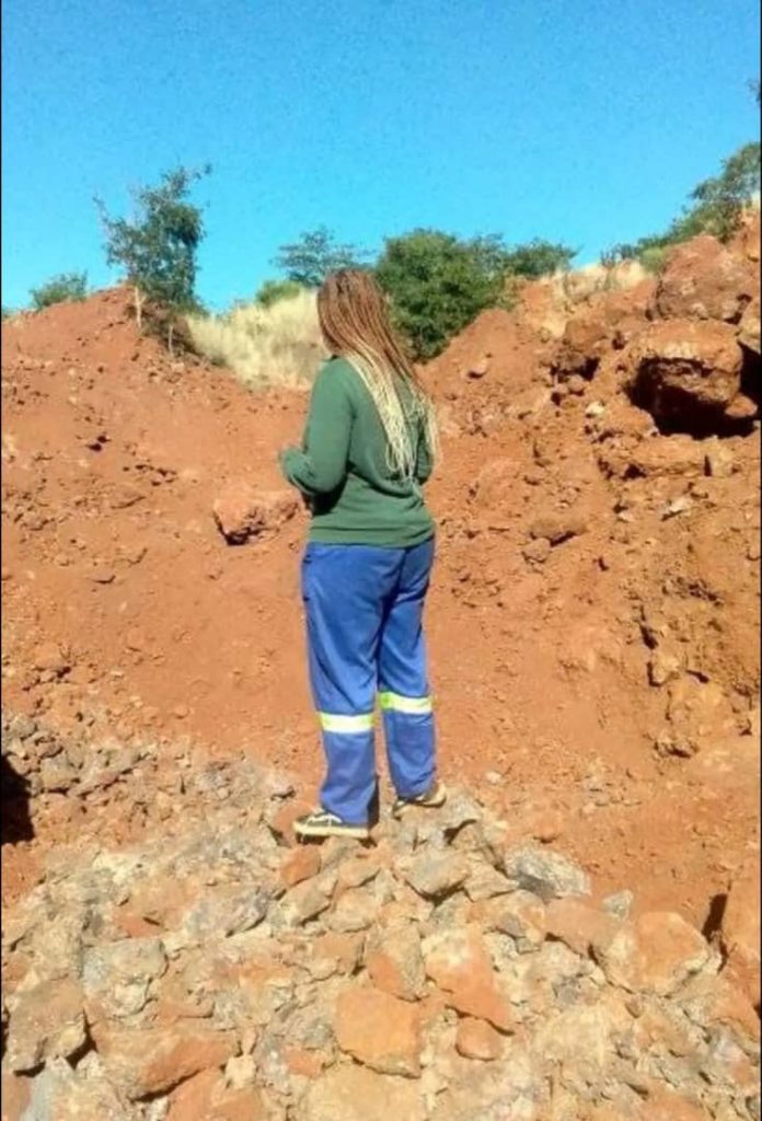 Namatai Chipunza stands dejectedly on what used to be her mining claim