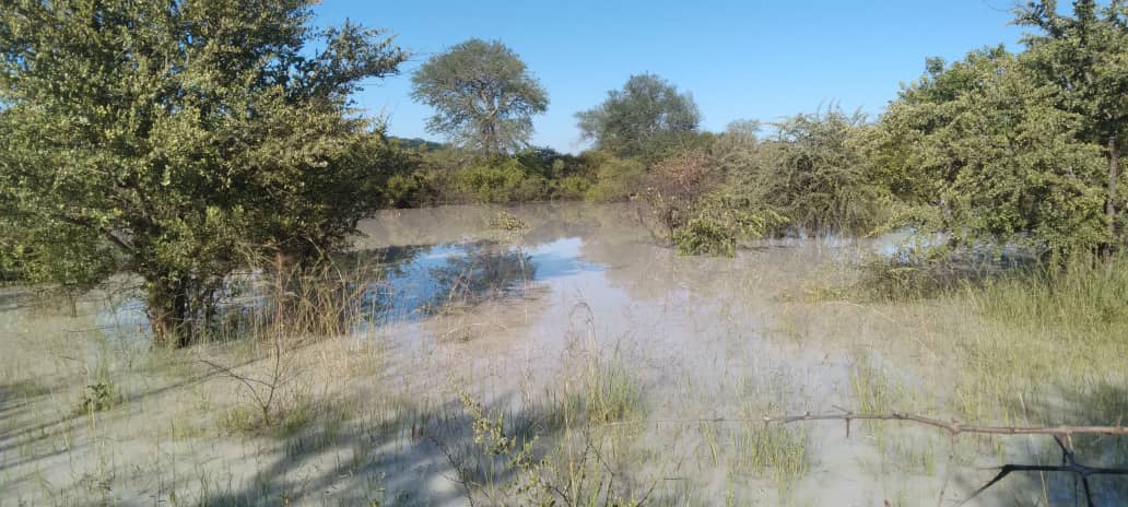 Villagers drink from the gully as miner shuts well